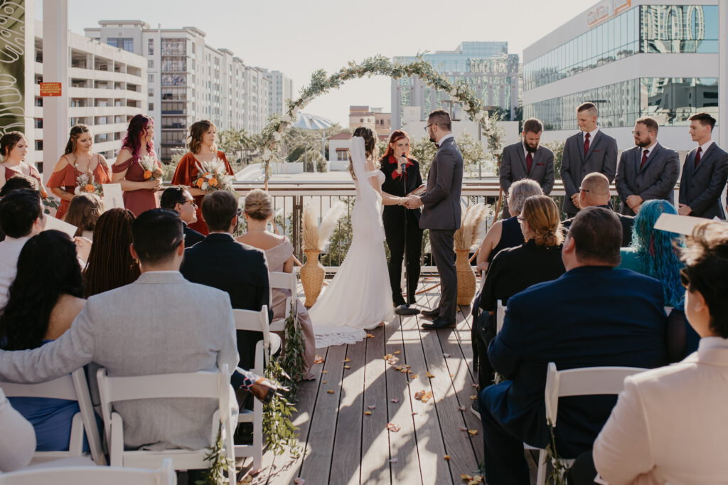 Bride and Groom De Santo Rooftop Wedding Ceremony Ideas | St. Petersburg Venue Red Mesa Events | Planner Coastal Coordinating