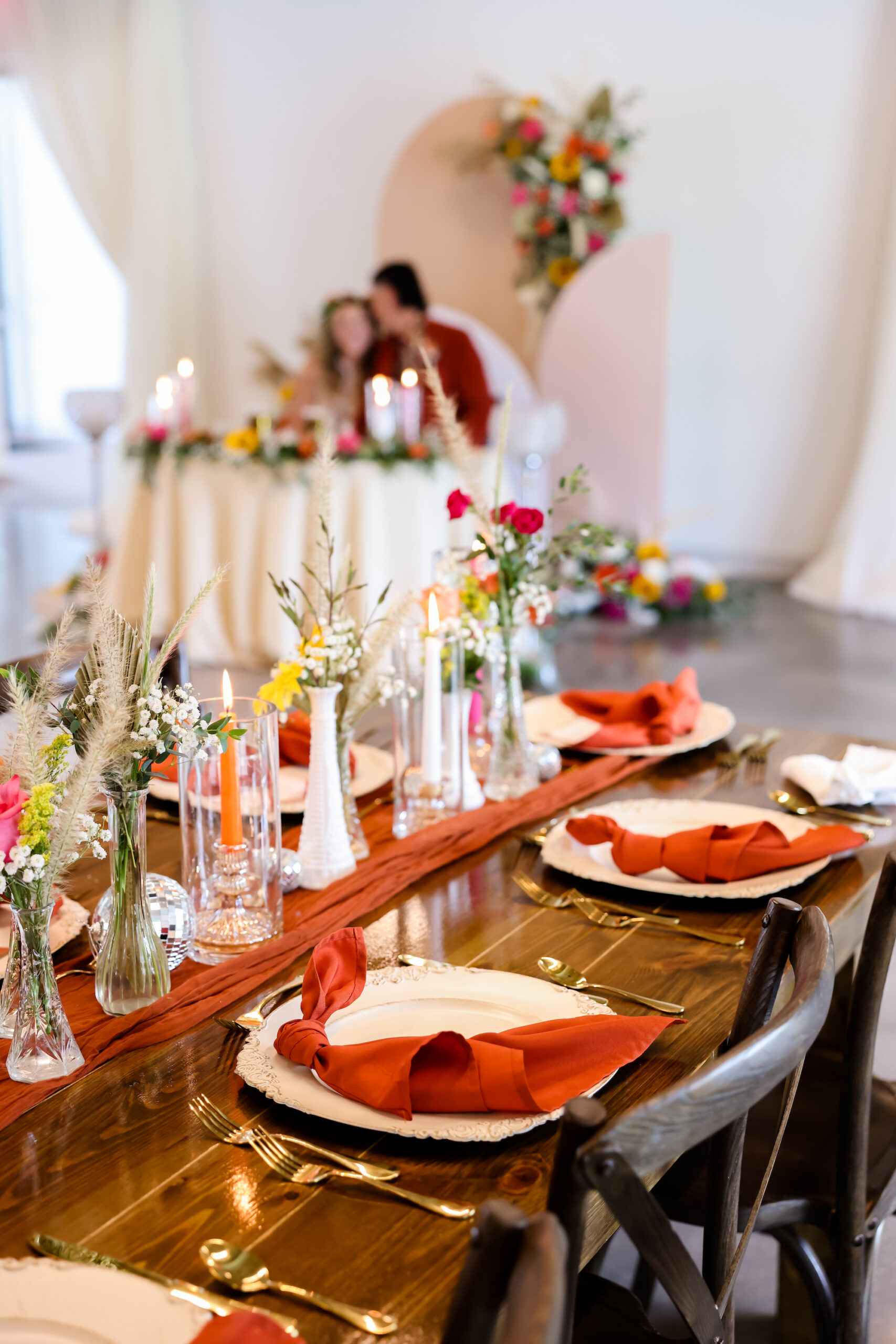 Vintage Fall Boho Wedding Reception Disco Ball and Floral Centerpiece Ideas | Orange Terracotta Table Runners and Napkins | Tampa Bay Rentals Outside the Box Rentals