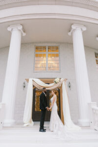 Bride and Groom Exchange Vows During Vintage Old Hollywood Gatsby Inspired Wedding Ceremony | Florida Wedding Venue The Whitehusrt Gallery