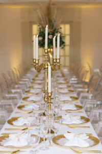 Vintage Old Hollywood Gatsby Inspired Wedding Reception Decor, Long Head Feasting Table, White Linens, Gold Chargers, Tall Floral Boho Centerpieces with greenery, blush pink roses and pampas grass, Gold Candlesticks | Tampa Bay Wedding Venue The Whitehurst Gallery | Rentals Gabro Event Services