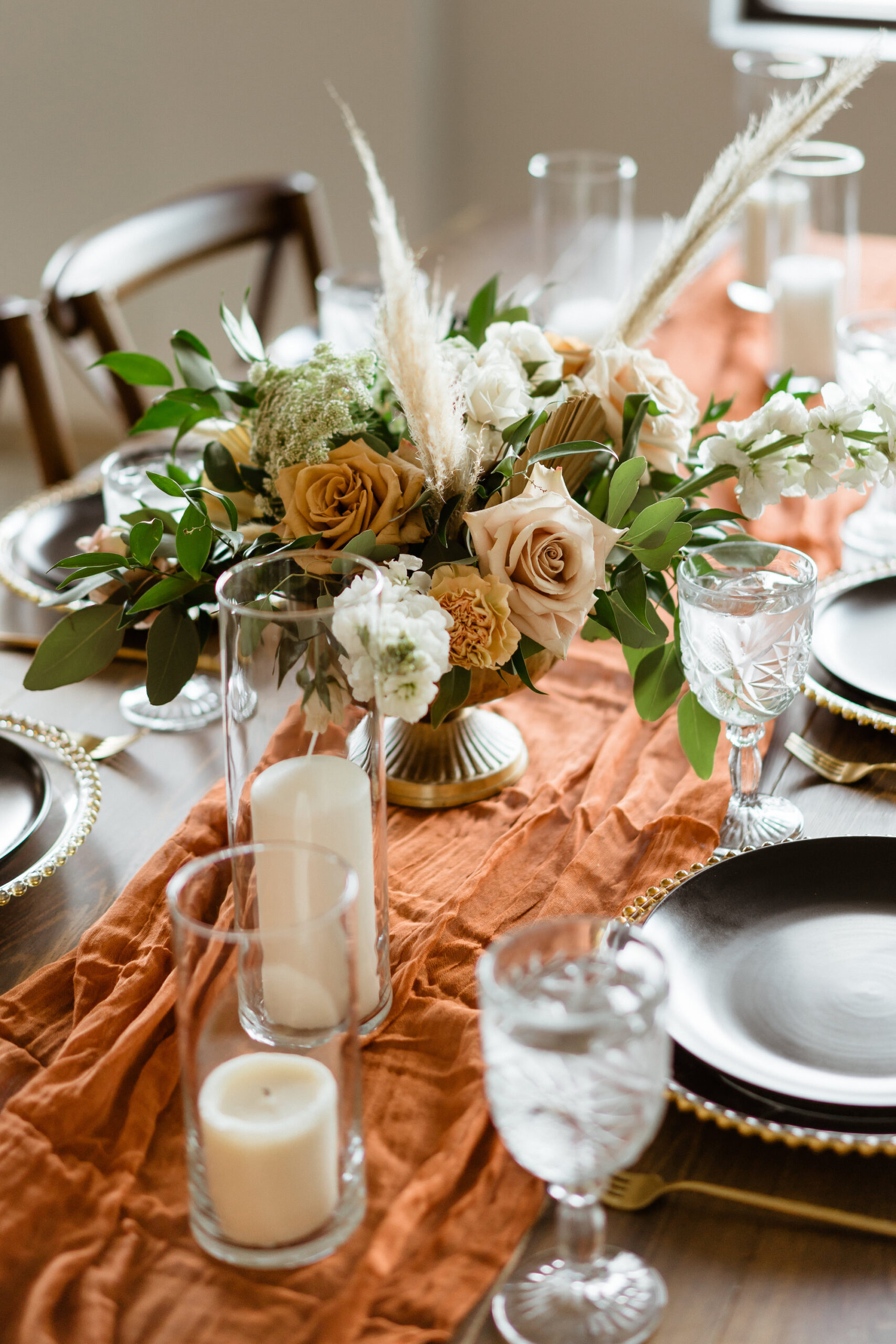 Orange Terracotta Table Runner With Candles and Boho Neutral Floral Wedding Reception Centerpiece Ideas