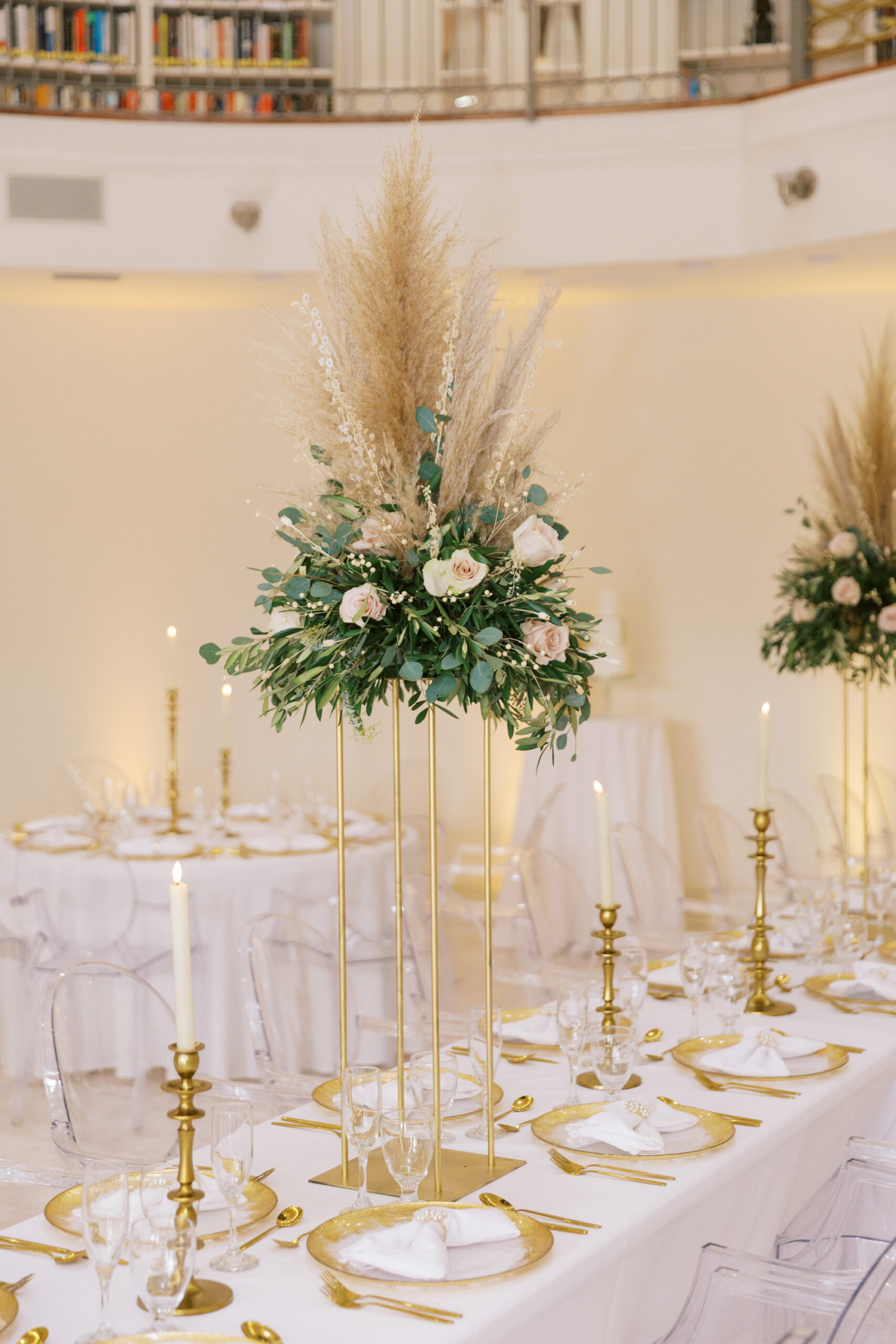 Vintage Old Hollywood Gatsby Inspired Wedding Reception at The Whitehurst Gallery Wedding Venue, Long Head Feasting Table, Round Circle Table, White Linens, Gold Chargers, Tall Floral Centerpieces | Gabro Event Services | Outside The Box Event Rentals