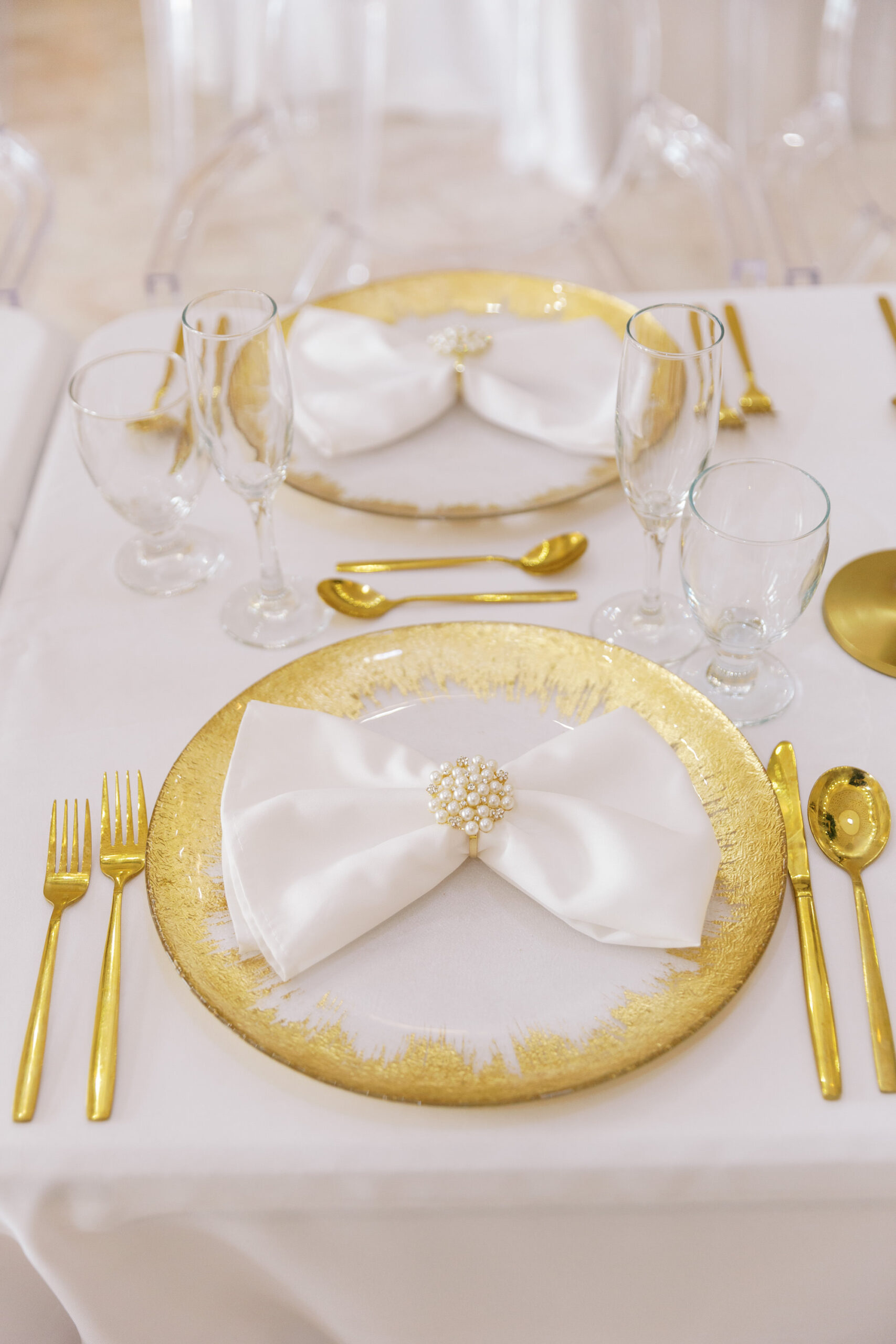 Vintage Old Hollywood Gatsby Inspired Wedding Reception Decor, Table Setting with Gold Chargers and Flatware, White Linens | Tampa Bay Rentals Gabro Event Services