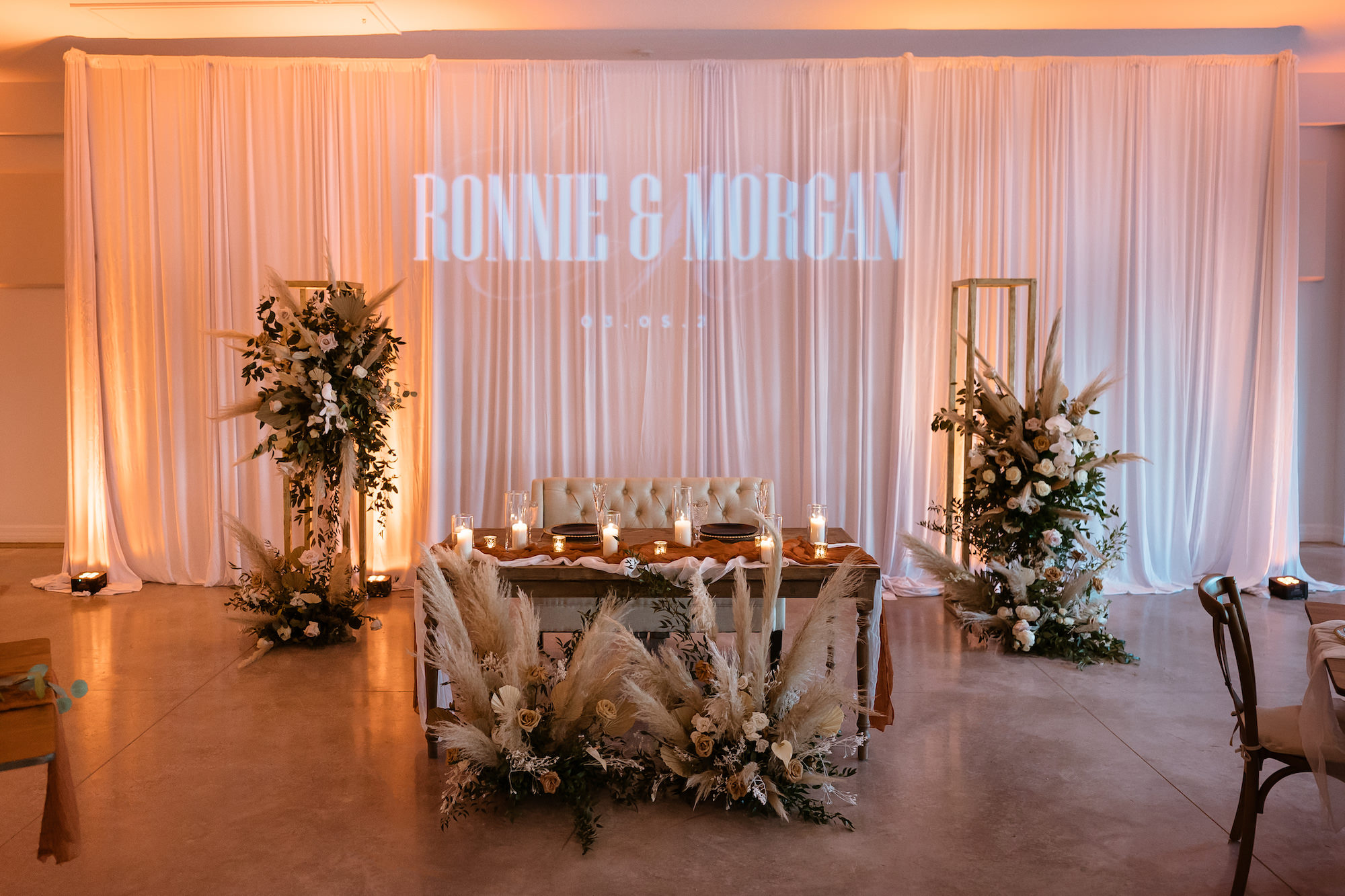 Personalized Wedding GOBO Lighting Monogram | Beige Neutral Boho Floral Arrangements | Sweetheart Head Table Inspiration