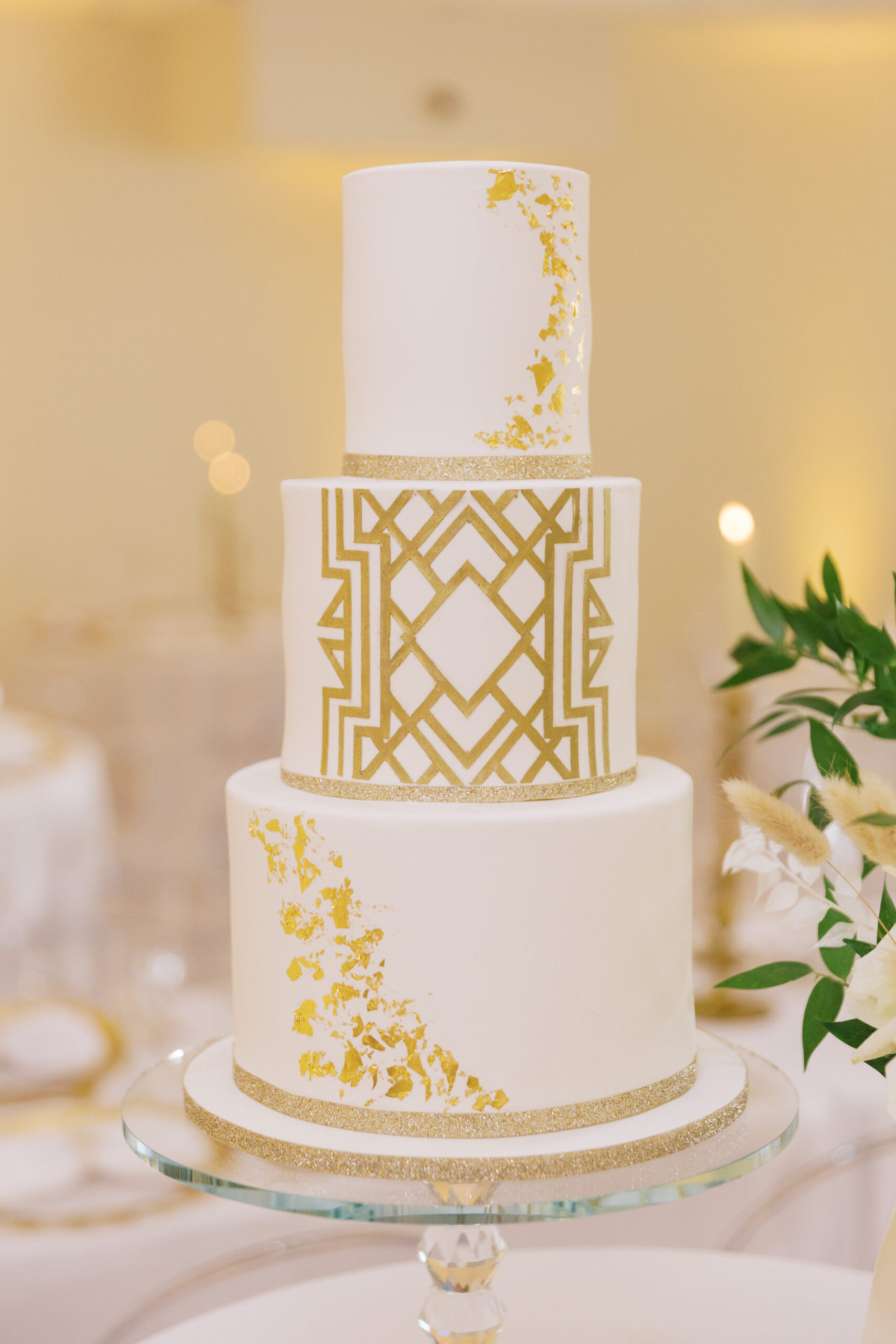 Vintage Old Hollywood Gatsby Inspired Wedding Cake, Three Tier White Cake With Gold Geometric Design and Foil | Tarpon Springs Wedding Venue The Whitehurst Gallery