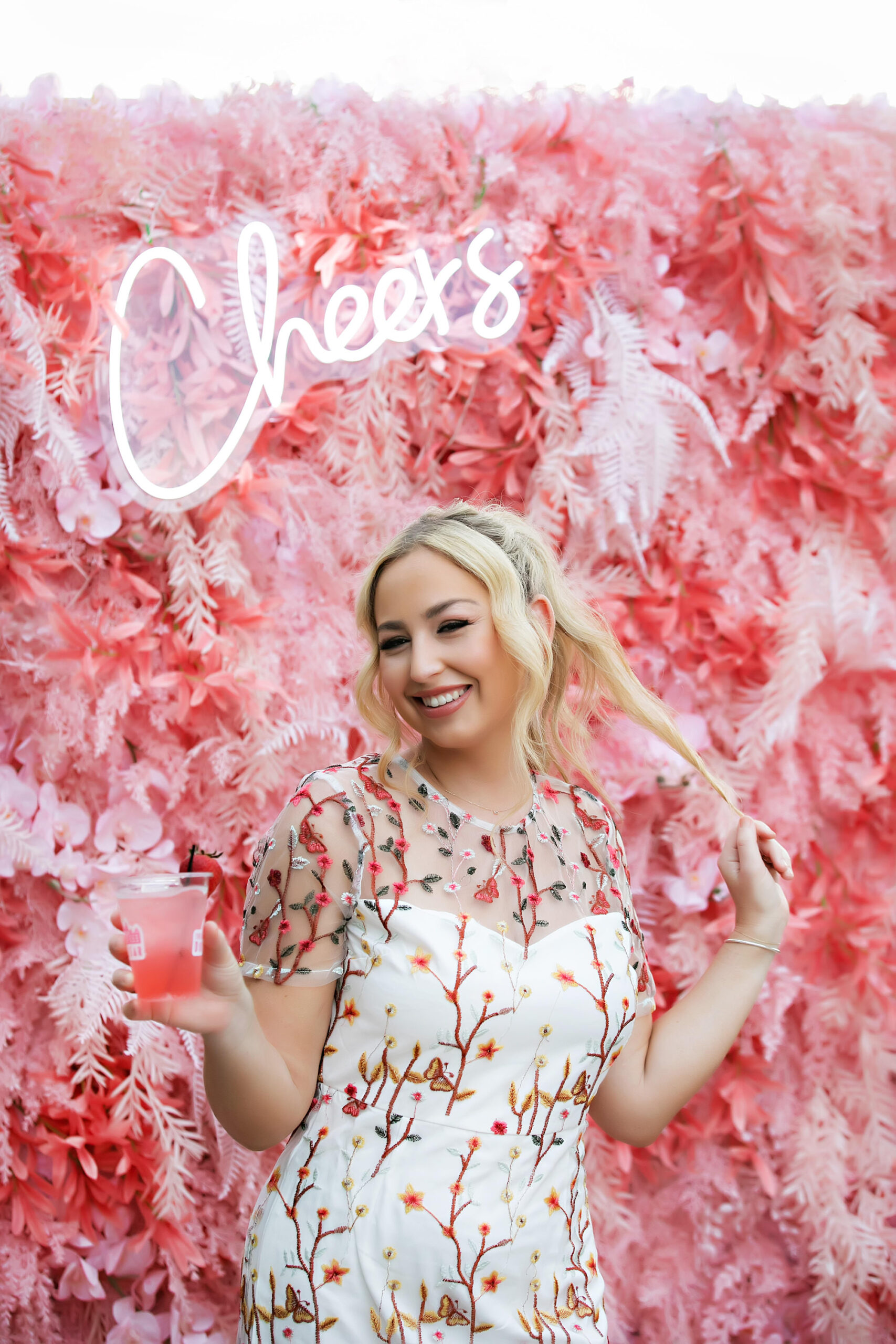 Bride Short Sleeve Party Dress | Pink Flamingo Themed Flower Photo Wall for Wedding Welcome Party Brunch | Tampa Bay Wedding Dress Truly Forever Bridal Tampa | Hair and Makeup Artist Adore Bridal