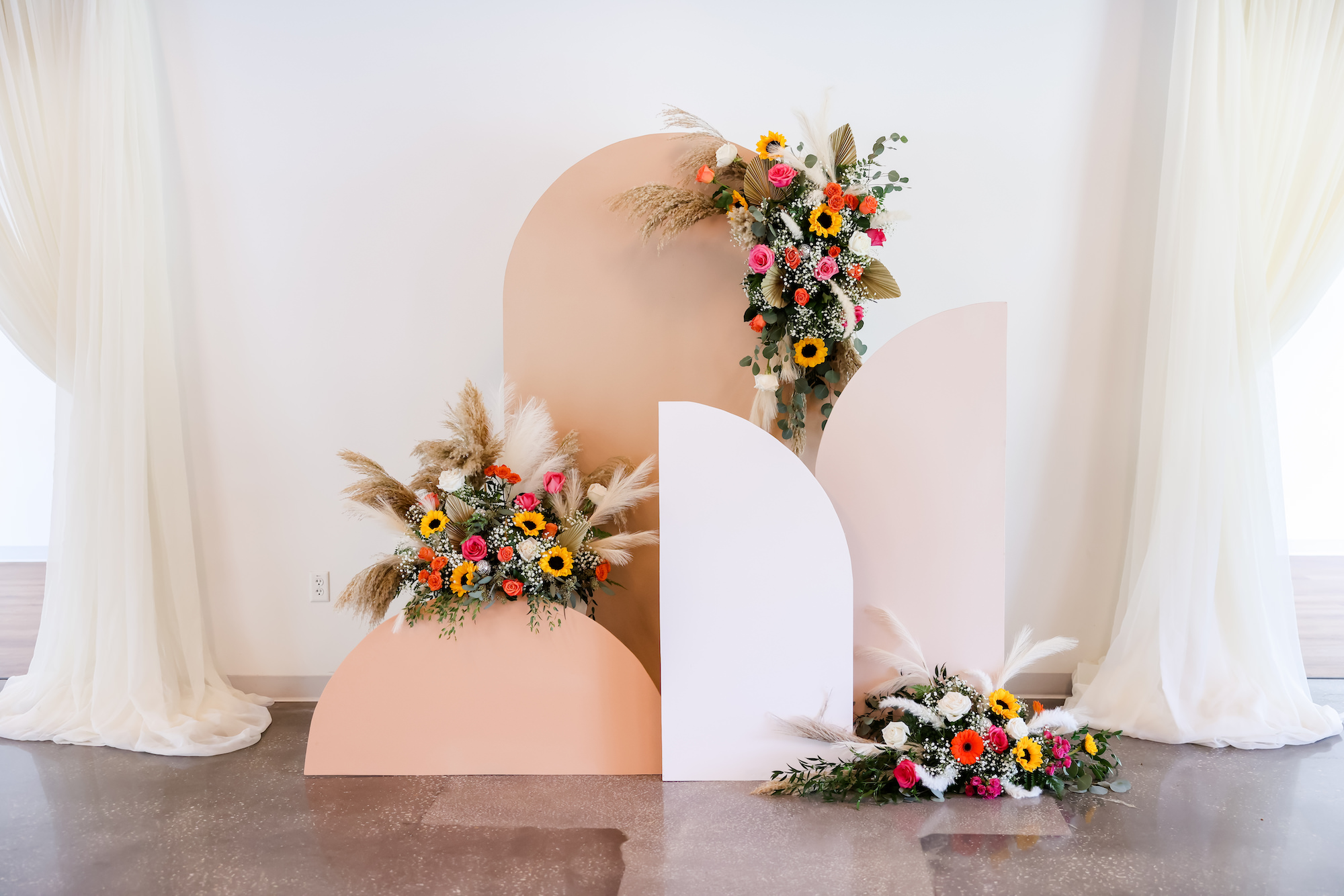 Geometric Neutral Retro Boho Wedding Ceremony Altar Backdrop with Asymmetrical Floral Arch Arrangements | Tampa Bay Rentals Outside the Box Rentals