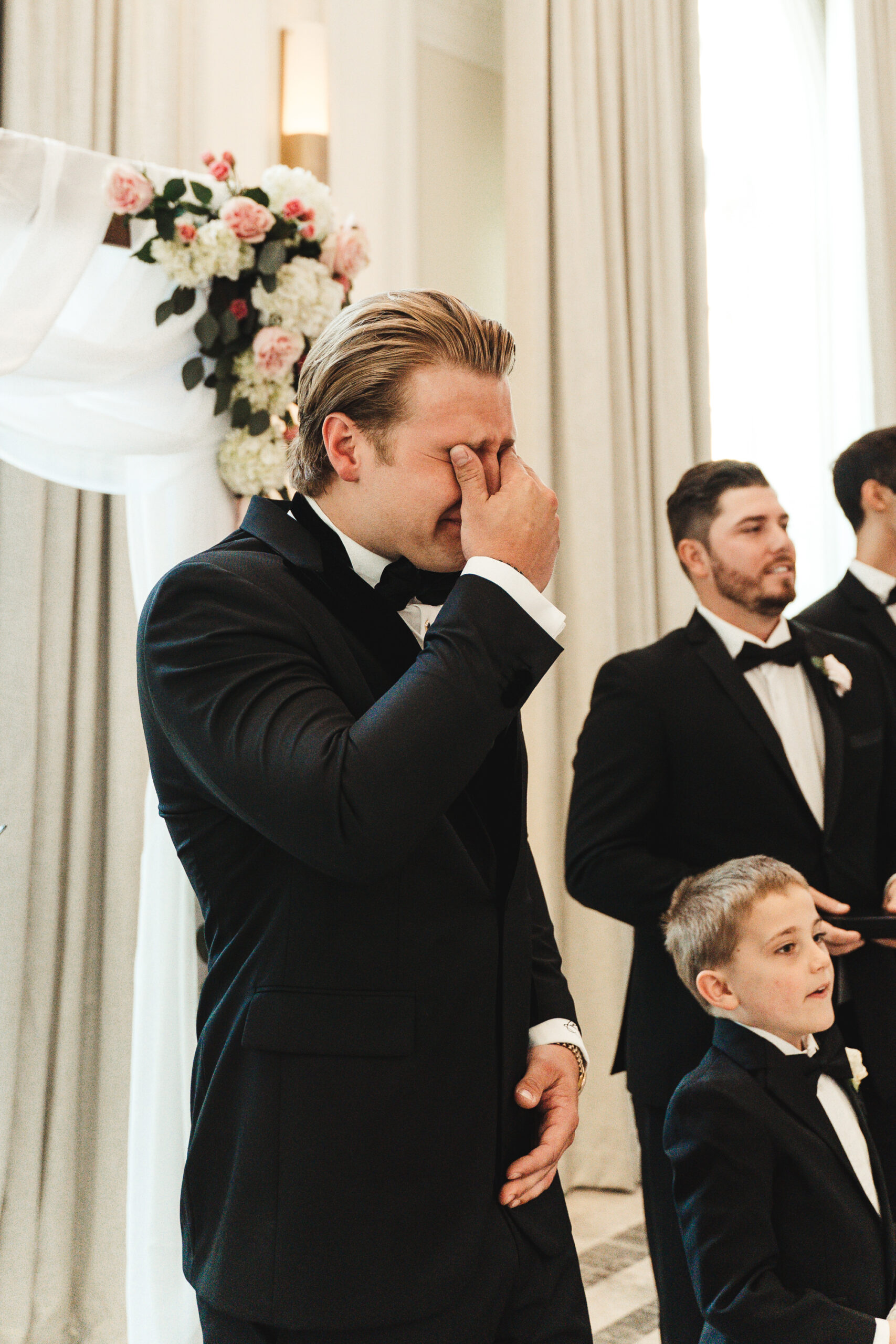 Groom's Reaction to Bride Walking Down Aisle | Black Bowtie and Black Tuxedo Groom Groomsman Wedding Inspiration | Tampa Bay Photographer J&S Media