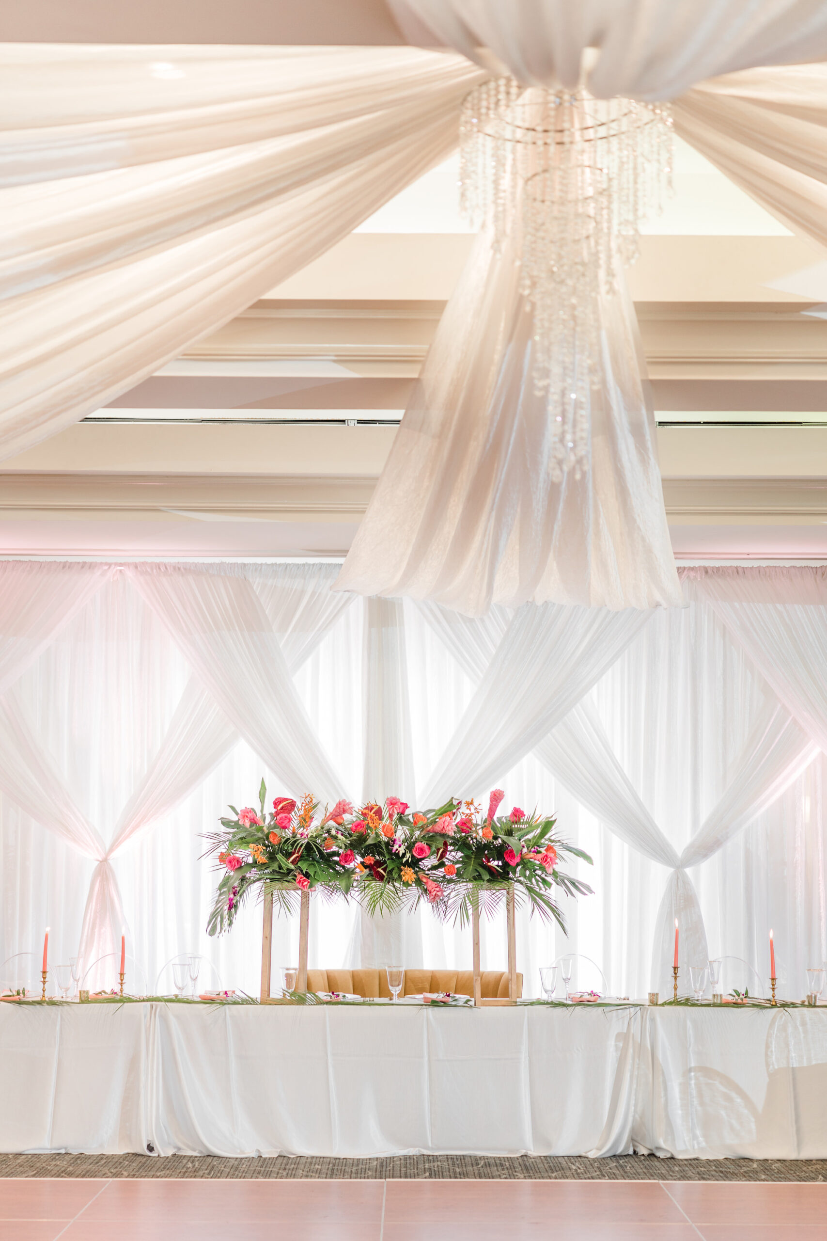 Romantic Tropical Wedding Reception with White Drapery and Crystal Chandelier | Indoor Wedding Reception Tampa Bay Golf and Country Club | Florist Save the Date Florida