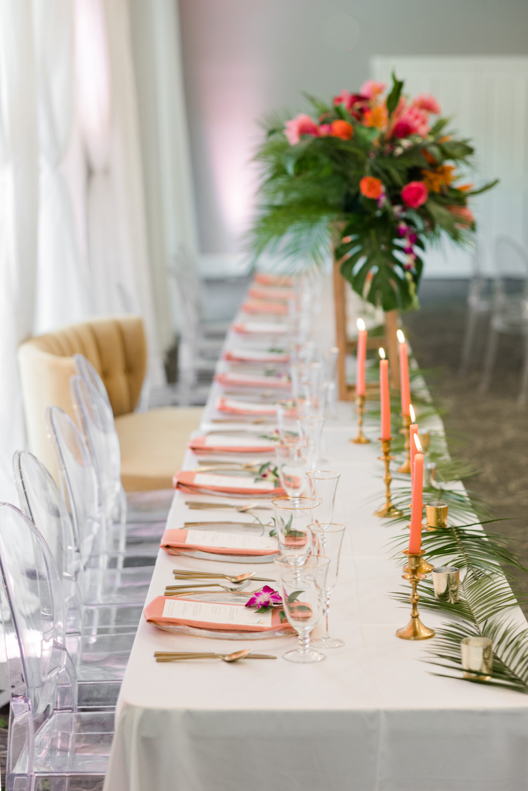 Tropical Wedding Reception Feasting Head Table | Oval Acrylic Ghost Chairs | Tampa Bay Rentals A Chair Affair