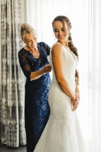 Bride and Mother Getting Ready Wedding Portrait | Navy Mother of the Bride Dress Ideas | White Deep V Neckline Lace Fit and Flare Olia Zavozina Wedding Dress