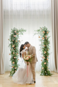Intimate Bride and Groom Portrait | Peach Roses with White Philadelphius Flowers and Fern Greenery Wedding Ceremony Arch Arrangement Inspiration | Tampa Bay Venue Hotel Haya