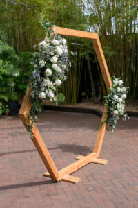 Garden Wedding Decor Ideas | White Roses with Blue Thistle and Eucalyptus Greenery Wedding Ceremony Arch Flower Arrangement Inspiration