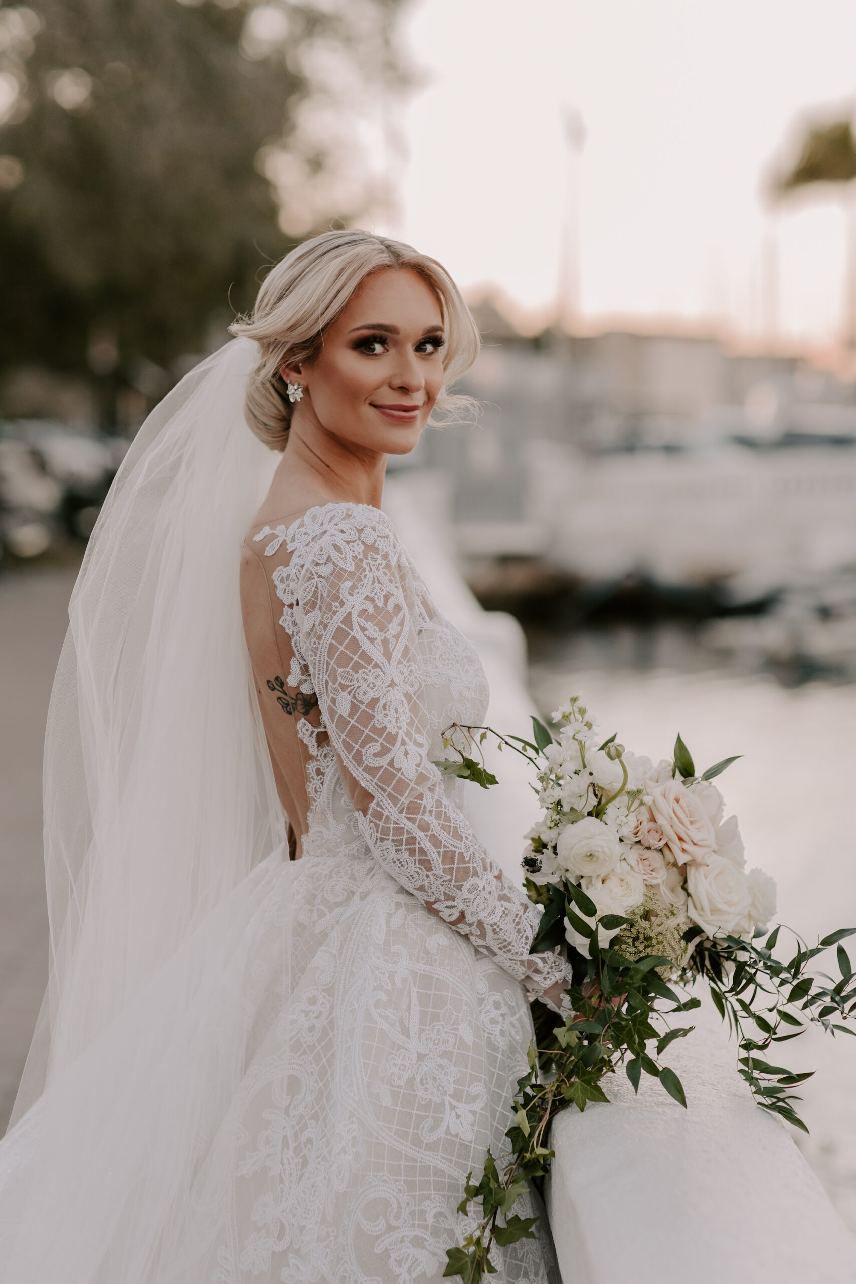 Classic Bridal Hair and Makeup Inspiration | Ivory Champagne Embroidered A-line Deep V-Neckline Sheer Long Sleeve Keyhole Back Applique Chapel Train Hailey Paige Dalton Wedding Dress