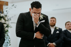 Groom's Reaction to Bride Walking Down Aisle Wedding Portrait