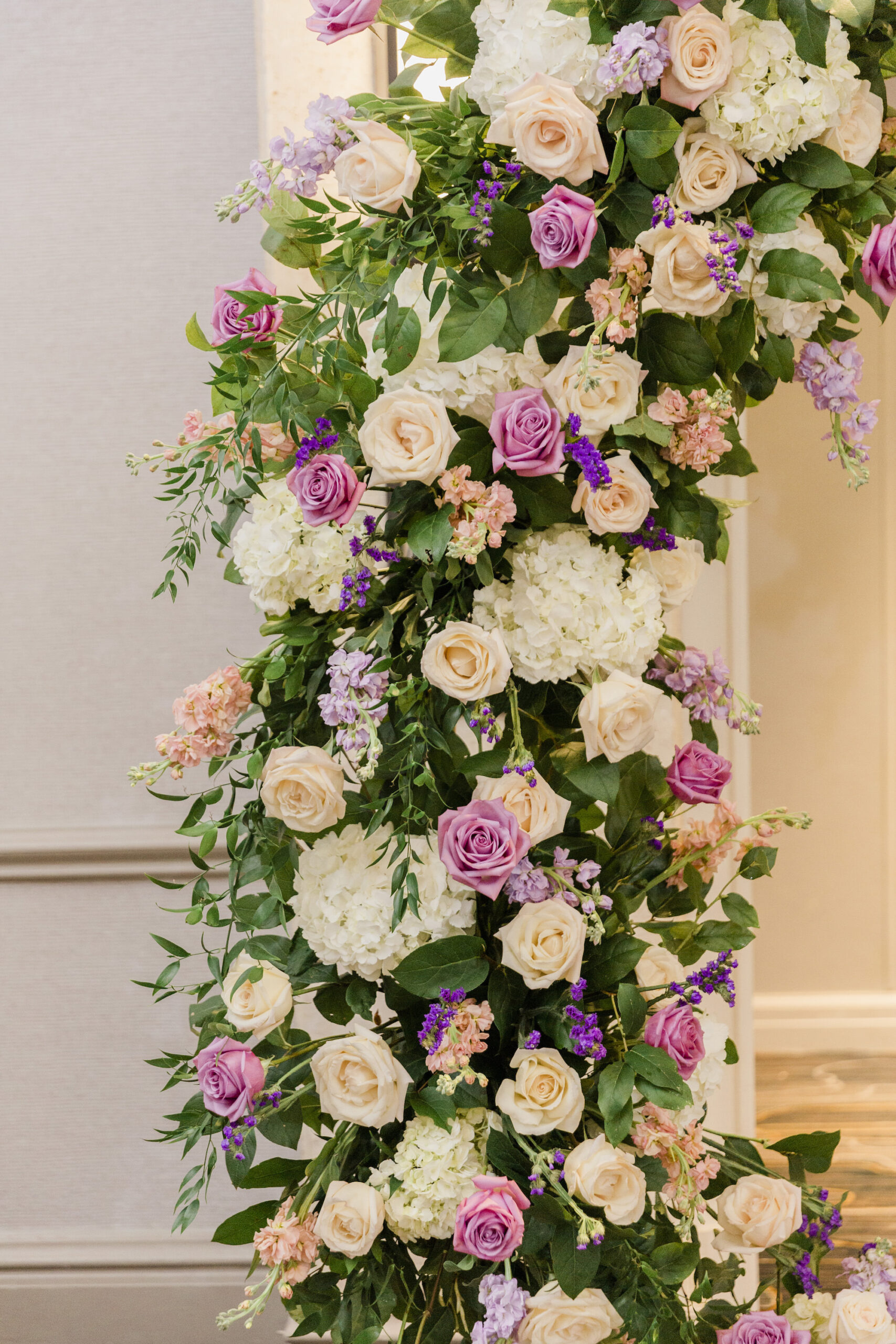White Hydrangeas, Stock Flowers, Purple, and Blush Pink Roses for Wedding Ceremony Arch Backdrop Inspiration