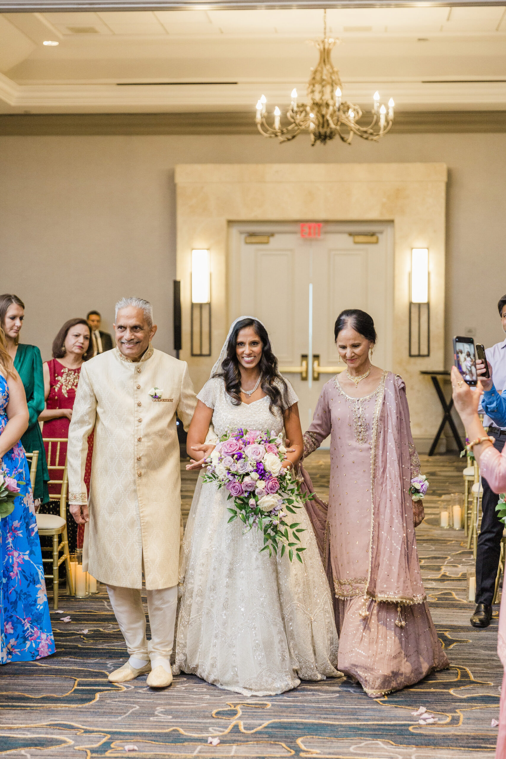 Bride Walking Down Wedding Aisle with Parents | Indian Wedding Inspiration