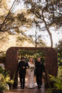 Bride Walking Down Aisle with Father and Stepfather Wedding Portrait