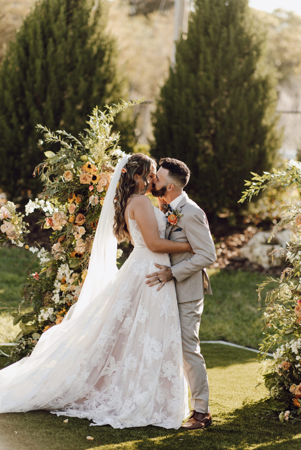 Bride and Groom First Kiss Wedding Portrait | Outdoor Lawn Ceremony | Dade City Wedding Venue at the Block