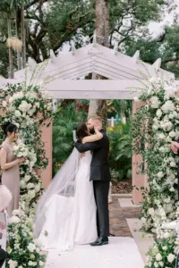 Bride and Groom First Kiss in Romantic Timeless Wedding Garden Ceremony | St Pete Venue The Vinoy
