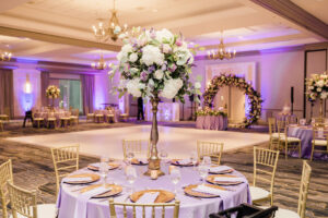 Elegant Purple and Gold Indian Wedding Reception Inspiration | Tall Flower Stand Centerpieces and Purple Lavender Linens | Tampa Bay Rentals Gabro Event Services