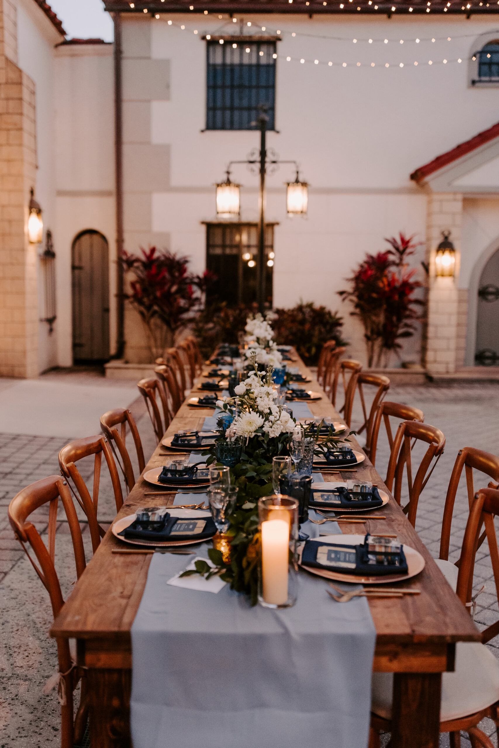 French Country Inspired Outdoor Courtyard Reception | Long Feasting Tables | Dusty Blue Wedding Ideas