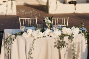 Classic Sweetheart Head Reception Table with White Roses, White Anemone, and Greenery Inspiration