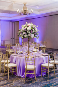 Tall Gold Flower Stand with White Hydrangeas, Purple, Pink, and White Roses, and Eucalyptus Greenery Wedding Reception Centerpiece Decor Ideas | Tampa Bay Rentals Gabro Event Services