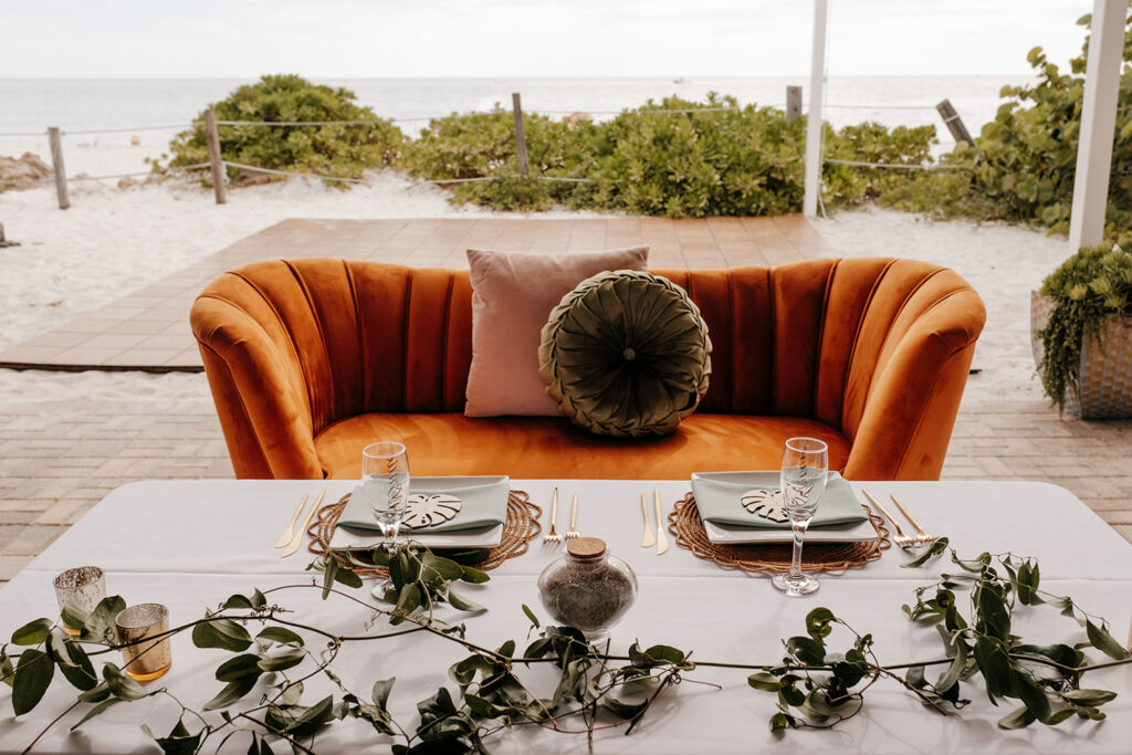 Vintage Boho Beach Orange Velvet Love Seat Boho Wedding Reception Sweetheart Table Inspiration