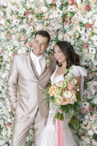 Wedding Reception Flower Wall Backdrop for Photobooth with Greenery, Peach, Pink, and White Flowers Inspiration
