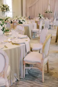 White Elegant Luxury Vintage Padded Chairs with Neutral Linens and Gold Flatware Round Table Inspiration | Classic Wedding Reception Ideas