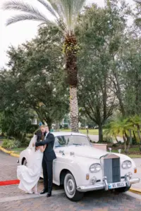 Bride and Groom Vintage Rolls Royce Classic White Getaway Car Wedding Portrait Inspiration