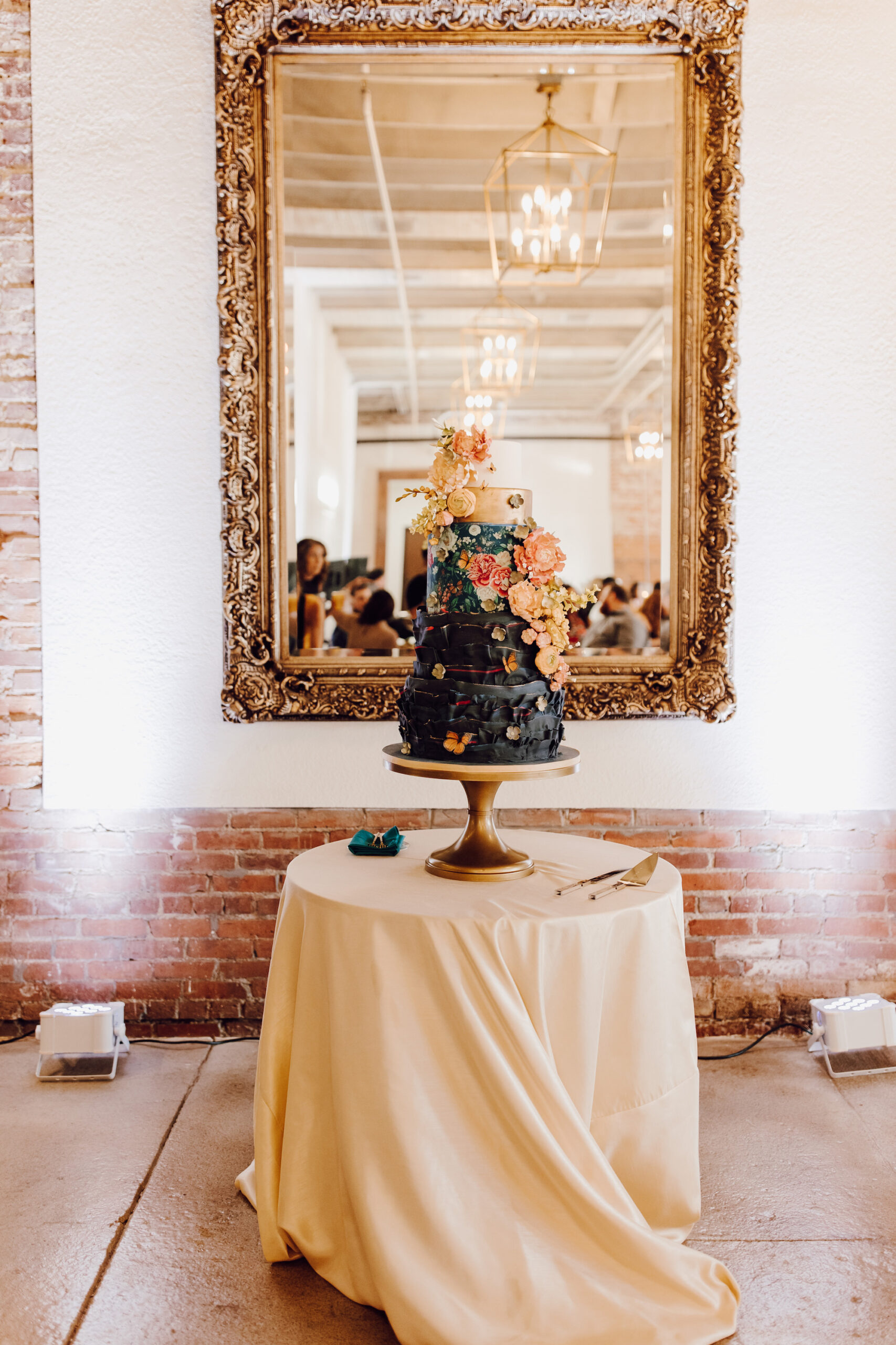 Whimsical Four-tiered Wedding Cake with Black Fondant and Edible Flowers Ideas