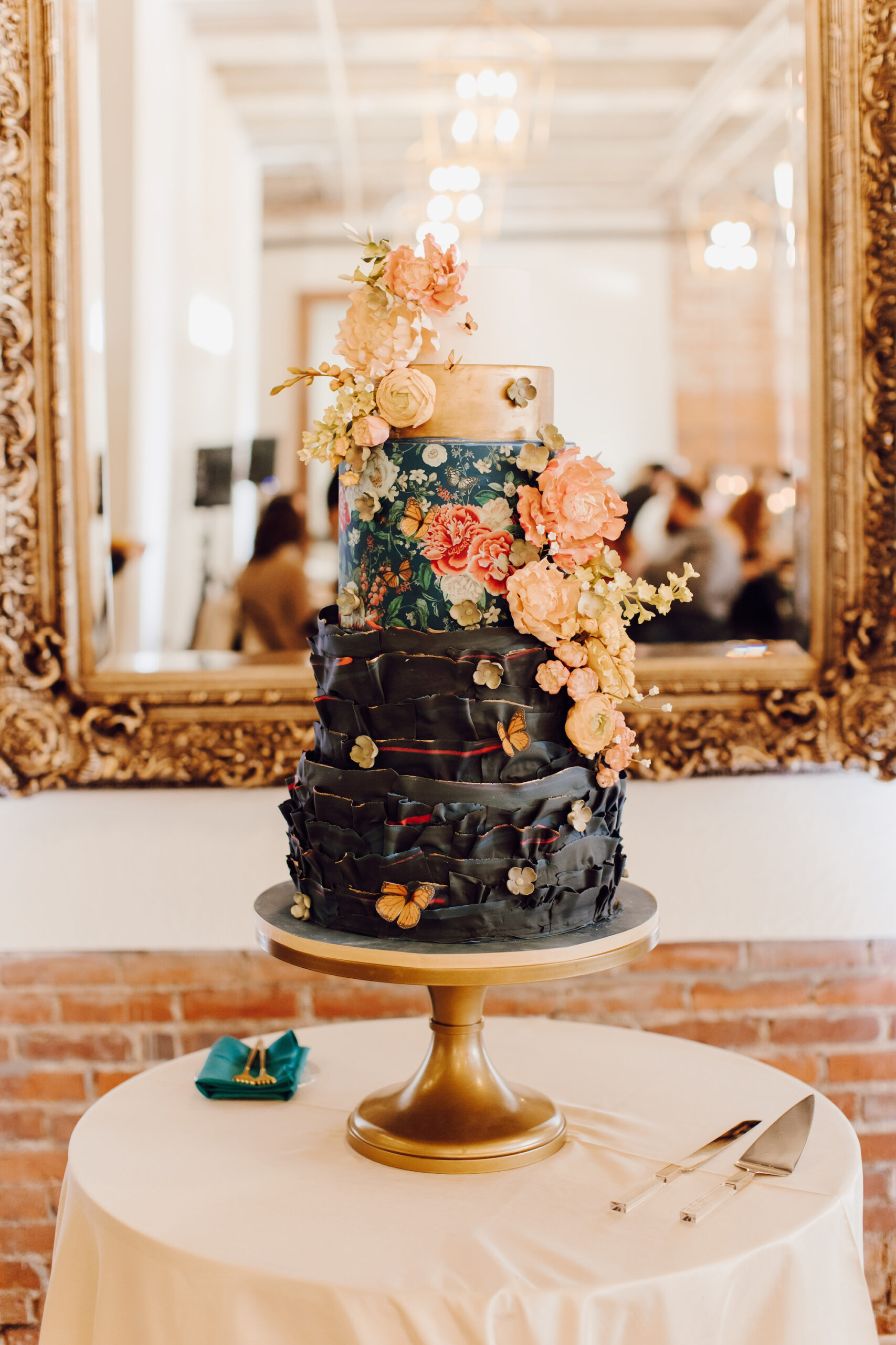 Whimsical Four-tiered Wedding Cake with Black Fondant and Edible Flowers Inspiration