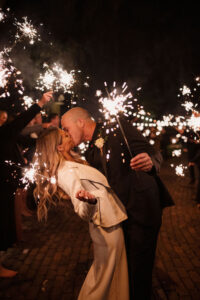 Bride and Groom Sparkler Grand Exit | White Satin Dress and Leather Jacket Wedding Reception Look Inspiration