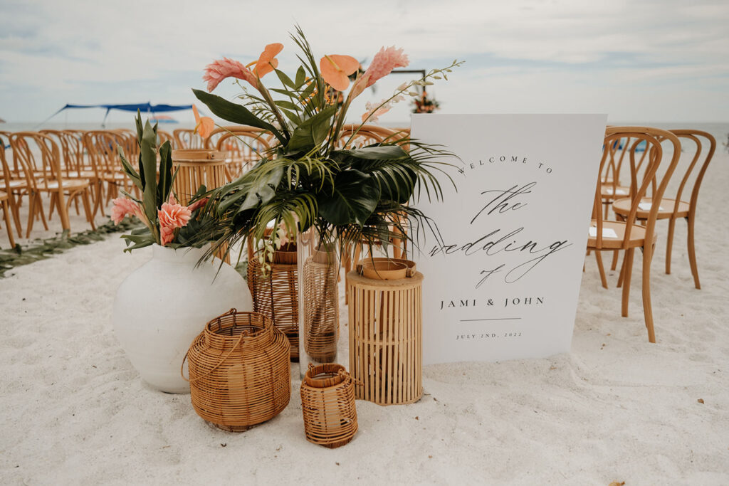 Peach Tropical Boho Beach Wedding Ceremony Decor | Rattan Lanterns | White and Black Welcome Wedding Sign Ideas