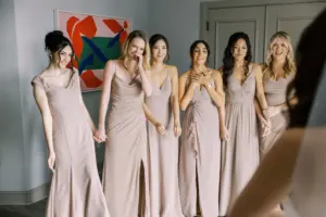 Bridesmaids in Taupe Floor Length Mix and Match Wedding Dresses First Look with Bride Wedding Portrait