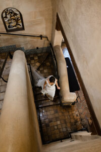 Bride Walking Down Stairs | Sarasota Wedding Venue Powel Crosley Estate | Photographer Garry & Stacy Photography