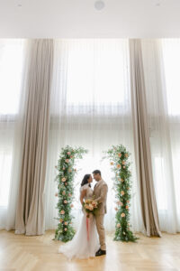 Bride and Groom Private Vow Exchange Ideas | Peach Roses with White Philadelphius Flowers and Fern Greenery Wedding Ceremony Arch Arrangement Inspiration | Tampa Bay Venue Hotel Haya