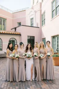 Neutral Taupe Floor Length Bridesmaids Mix and Match Wedding Dress Ideas | Bride Holding White and Greenery Classic Wedding Bouquets Portrait