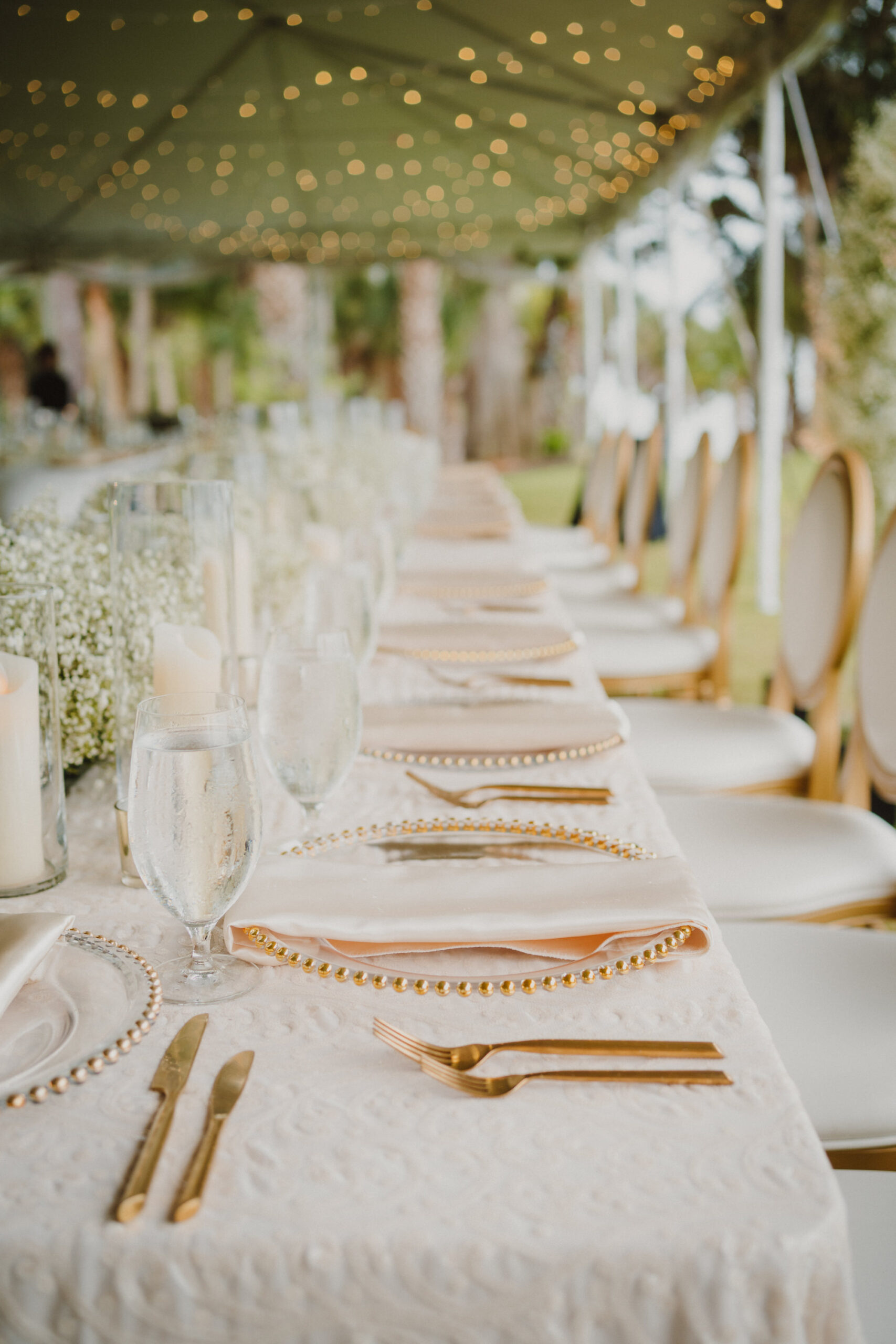 Timeless White and Gold Wedding Reception Table Setting | Gold Beaded Chargers and Flatware | Tampa Bay Kate Ryan Event Rentals