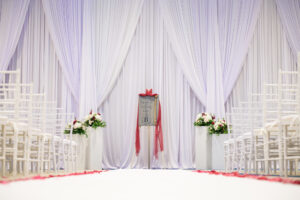 Romantic White Drapery Wedding Ceremony Inspiration | White Column Flower Stand Altar Decor | Red Rose Petals On Aisle