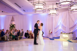 Bride and Groom First Dance Wedding Portrait |.White Dance Floor Wrap and Draping Inspiration | Rentals Gabro Event Services | Venue Wyndham Grand Clearwater Beach Wedding