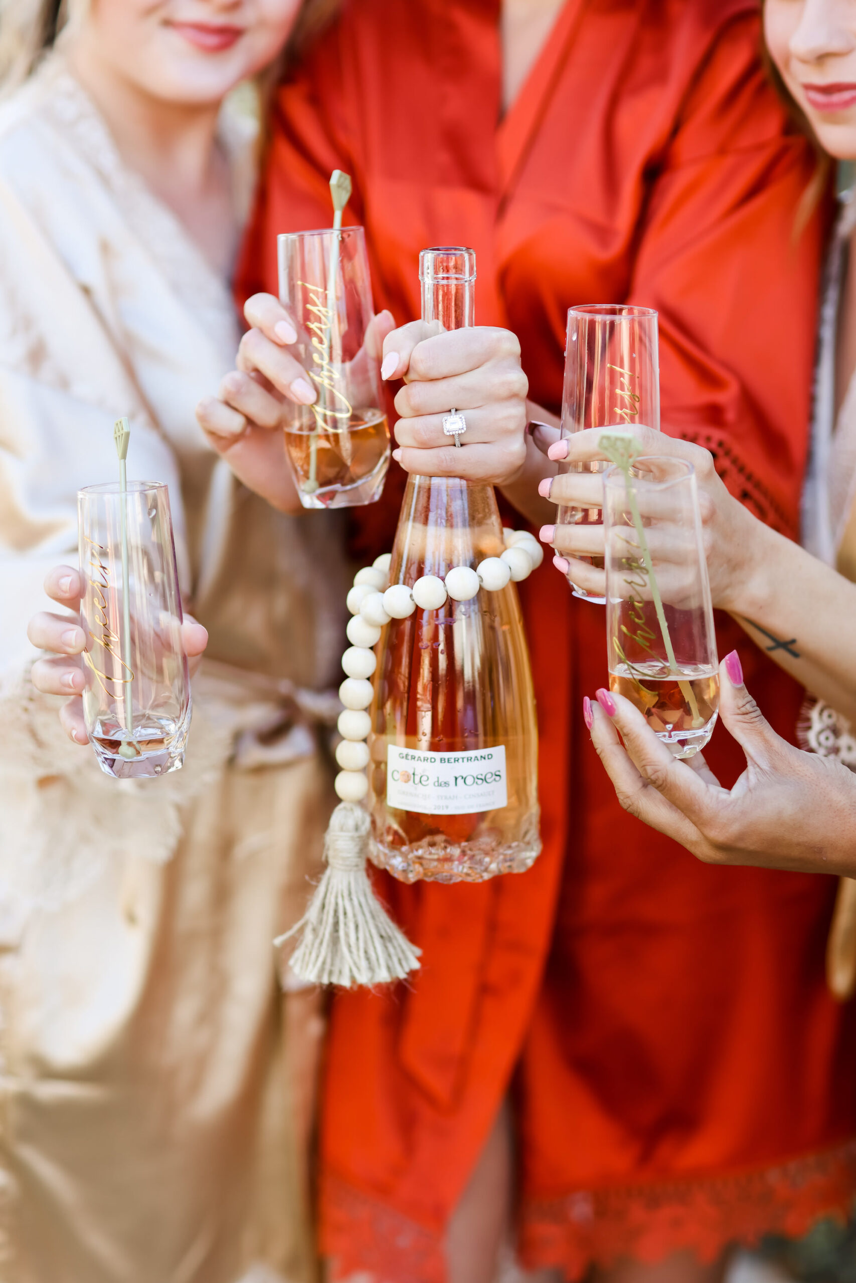 Bride and Bridesmaids Toast in Red Robes While Getting Ready Wedding Portrait | Lifelong Photography