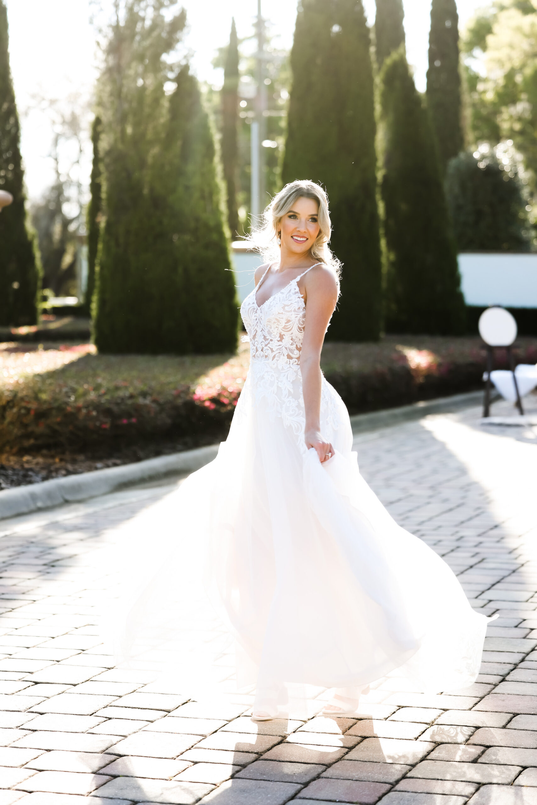 Bride with Half Up Half Down Hair and Open Back Spaghetti Strap Wedding Dress | Tampa Boutique Truly Forever Bridal | Hair and Makeup Artists Adore Bridal | Lifelong Photography Studio