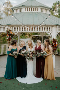 Bride with Bridesmaids in Fall Jewel Toned Bridesmaids Dresses Wedding Portrait | Sarasota Wedding Dress Boutique Truly Forever Bridal Tampa | Florist Beneva Weddings