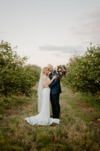 Bride and Groom Intimate Forehead Touch Wedding Portrait in Vineyard | Sarasota Bridal Gown Truly Forever Bridal