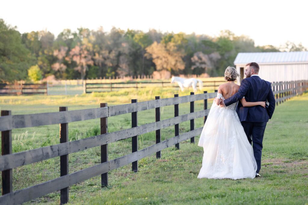Bride and Groom Southern Inspired Wedding Horse Pasture Portrait | Brooksville Wedding Venue Legacy Lane Weddings | Dress Truly Forever Bridal | Photographer Lifelong Photography