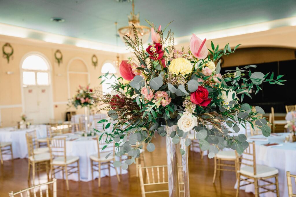 Tall Eucalyptus, Ruscus, Pink Anthurium, White and Maroon Roses Centerpiece Inspiration | Tampa Bay Florist Save The Date Florida