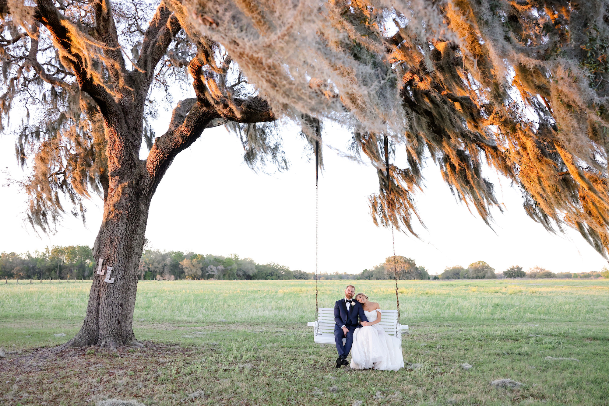 Bride and Groom Southern Inspired Swing Wedding Portrait | Brooksville Wedding Venue Legacy Lane Weddings | Dress Truly Forever Bridal | Photographer Lifelong Photography